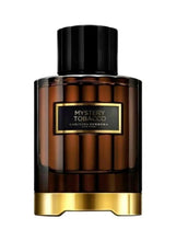 Eau de parfum bottle with black cap and amber-brown glass, gold base and label