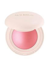 Luminous powder blush compact with pink blush pan, lid open