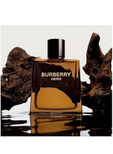 Amber eau de parfum bottle with black cap, Burberry Hero label on glossy surface.