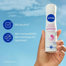 NIVEA Natural Radiance 72h antiperspirant spray, 0% alcohol, held in hand