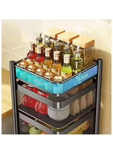 Blue rotating top on black mesh kitchen storage trolley with shelves for jars
