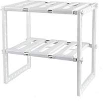 White two-tier under-sink storage rack with perforated sides and base shelves