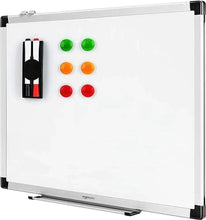 Magnetic whiteboard with colorful magnets and attached pen tray, white surface