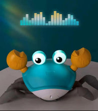 Blue crab toy with glowing LED eyes, orange claws, and gray legs with sound-wave lights