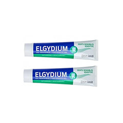 Two tube pack of Elgydium sensitive teeth toothpaste gel in blue white green packaging for sensitive teeth relief