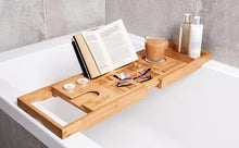 Bamboo bathtub tray with open book rest, device holder slots, and cup ring