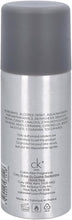 CK One deodorant spray bottle with back label showing ingredients and usage text