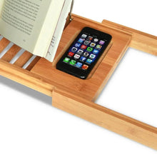 Bamboo bathtub tray with phone slot and book resting area on raised slats