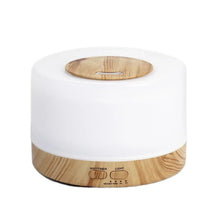White essential oil aroma diffuser with wood base and round top cover