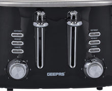 Black toaster front with two chrome lever handles, browning dials, and button controls