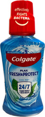 Colgate Plax mouthwash bottle, blue liquid with red cap and Cool Mint antibacterial label