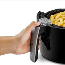 Black and grey air fryer with open basket handle and removable drawer.
