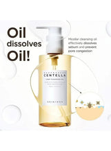 Centella light cleansing oil bottle with gold-amber liquid, circular droplet graphics