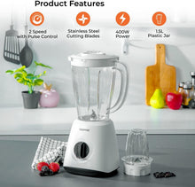 White blender set with clear jar and small cup, with attachments placed near base