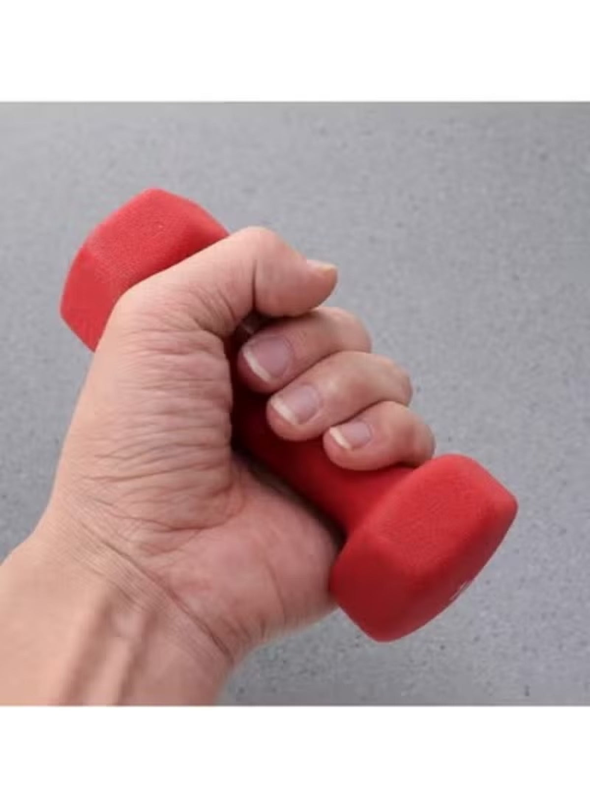 Hand gripping red 5kg neoprene dumbbells for sports fitness and outdoor workouts
