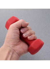 Hand gripping red 5kg neoprene dumbbells for sports fitness and outdoor workouts