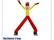 Inflatable dancing tube man in yellow torso and red pants with black boots
