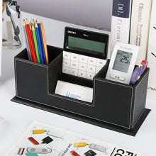 Black PU desk organizer with pens and office items in divided compartments.