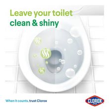 Toilet bowl cleaner action on toilet bowl with bubble spray and green mist