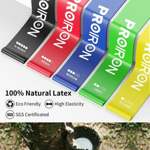 Five resistance loop bands in yellow, green, blue, red, and black, close-up labels