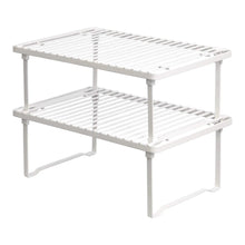 White stackable metal storage shelf unit with two slatted tiers and side supports