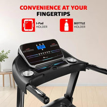 Treadmill console with display panel and two round speaker-like buttons on black frame.