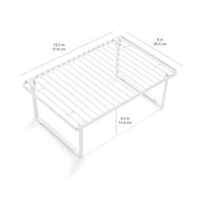 White metal kitchen storage shelf with slatted rack and four legs