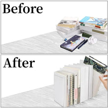 Clear acrylic bookends supporting a stack of books upright on a desk.