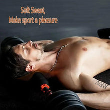Adjustable dumbbell used for strength training with dark plates and orange grip accents