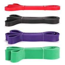 Resistance band set: coiled red, black, purple, and green loop bands