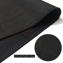 Black gaming mouse pad edge with textured anti-slip base and stitched border
