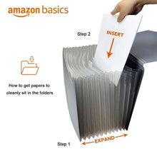 Black A4 expanding file folder with accordion dividers, paper being inserted