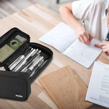Black pencil bag partially open with pens visible inside