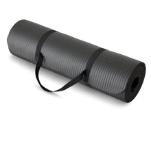 Rolled exercise yoga mat in dark gray with attached carrying strap