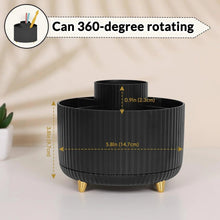 Ribbed black 360-degree rotating desk organizer with gold feet and open center for pens