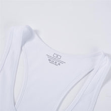 White tank top neckline and size label close-up