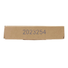 Cardboard battery package end with printed number "2023254"