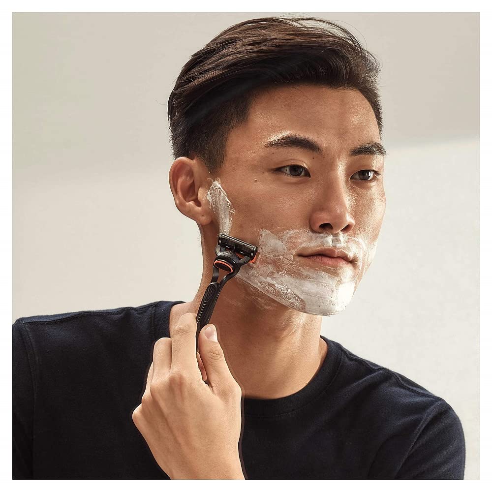 Man shaving with Gillette razor demonstrating a smooth close shave using Gillette Fusion razor blades 8 pack