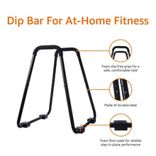 Dip fitness bar with three legs, foam grips and floor pads, black steel frame