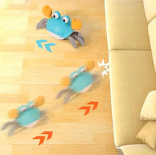 Blue electric crab toy crawling forward with obstacle-avoidance arrows