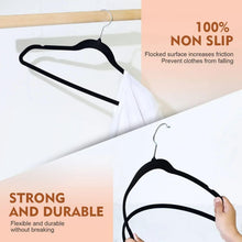Black flocked velvet clothes hanger with curved frame and metal hook