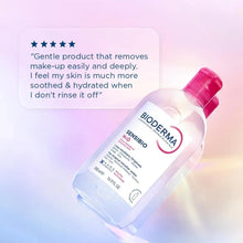 Micellar water bottle with red cap, angled view with label