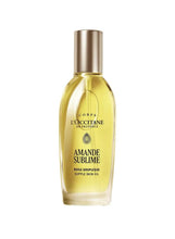 Almond skin oil bottle with clear yellow liquid and gold cap