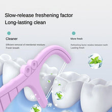Twin-line floss pick with fresh lime clean, shown between white teeth on care graphic