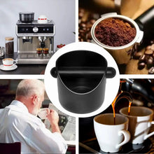 Black coffee grounds bucket with side handles, shown in close-up