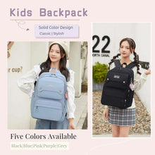 Kids backpack in black and light blue with front logo patch and adjustable straps
