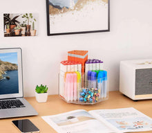 Clear acrylic pen organizer with six compartments, holding assorted colored markers