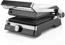 Black+DECKER electric grill, black and silver, open lid with grilling grates and knobs