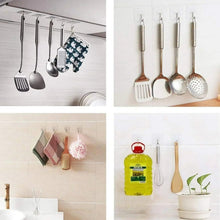 Transparent adhesive wall hooks with chrome metal S hooks holding spoons and ladles