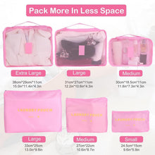 Pink packing cubes of multiple sizes with mesh windows and zipper tops